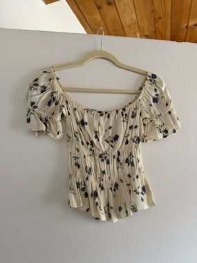 Reformation Cream Off-Shoulder Floral Smocked Top with Blue Print